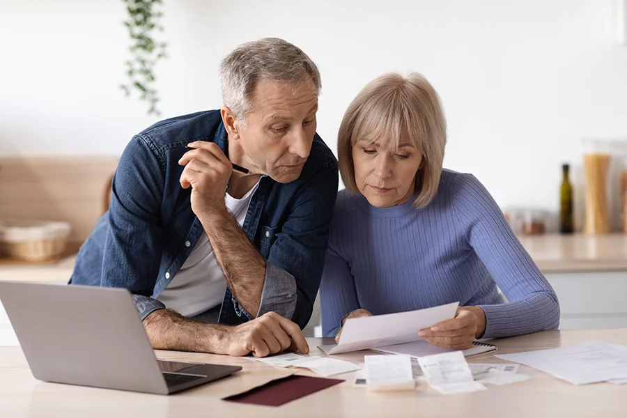 older couple paying bills